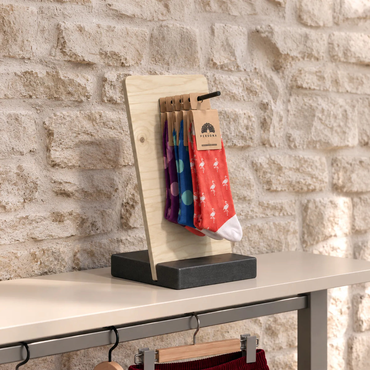 Pegboard table display on a wooden base
